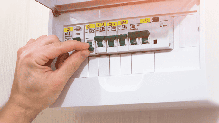 man hand checking the capacity of the circuit breaker