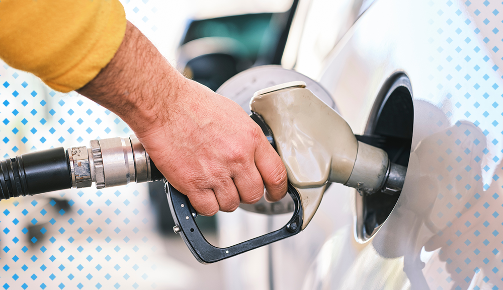 closeup of a gas pump inserted into a vehicle