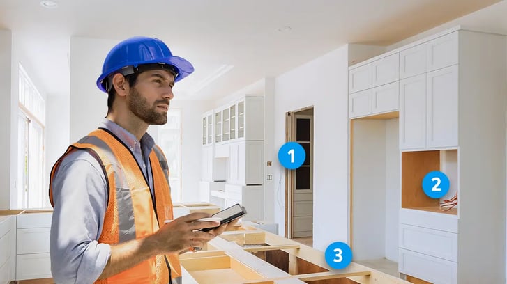 contractor in a kitchen remodeling electrical job thinking and identifying any concerns with an ipad on the hand using a digital sketch
