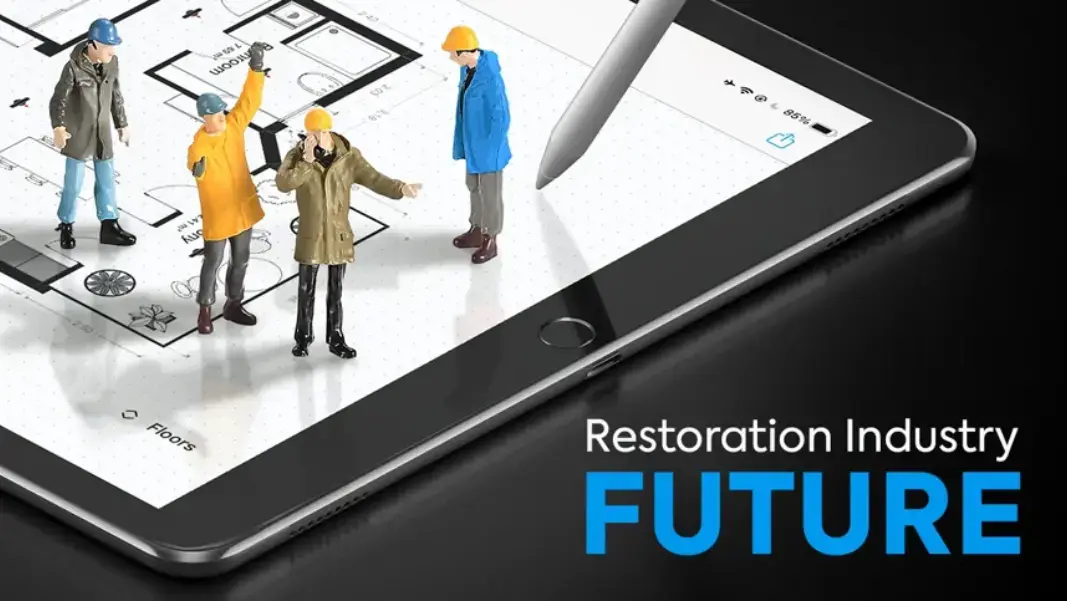 Restoration contractors on a sketch on an iPad representing the future of the restoration industry with an apple pencil