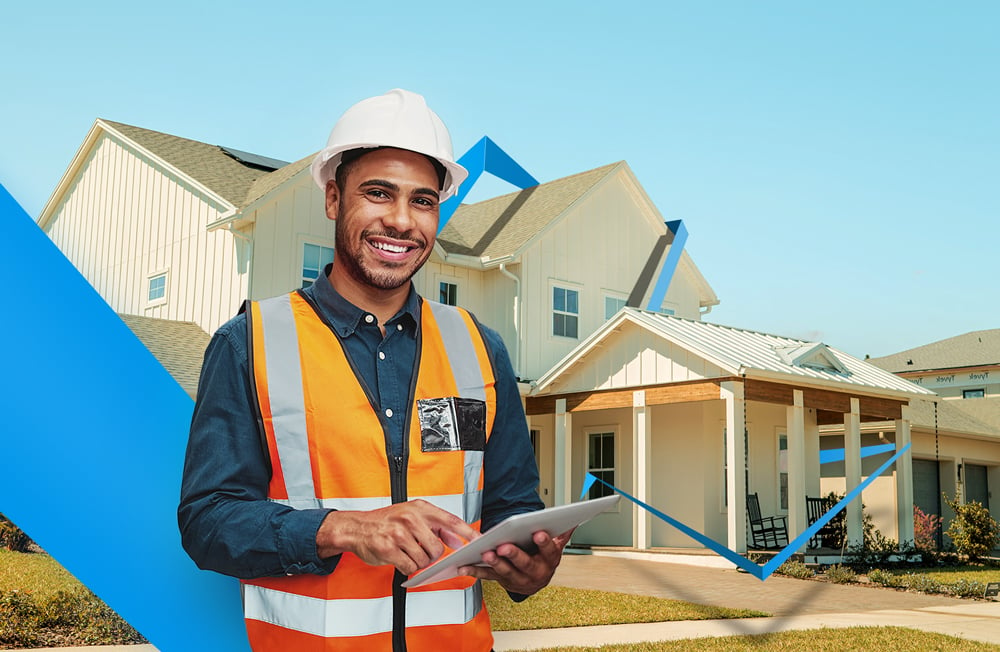 home inspector holding an ipad in front of a house that will be inspected