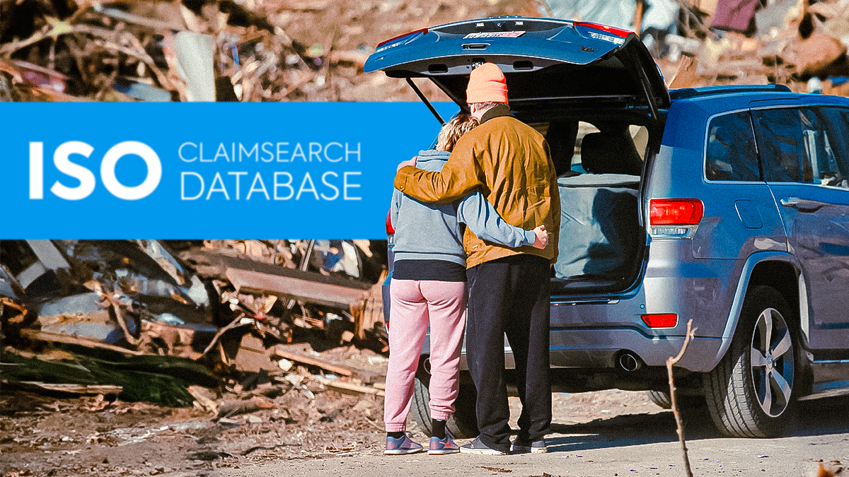 Text: ISO Claimsearch Database (Image of two people hugging each other at what looks like an aftermath of a a disaster)