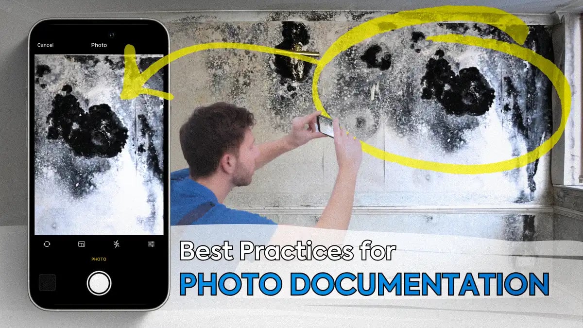 restoration contractor using a mobile device to take a photo of fire damage within a home