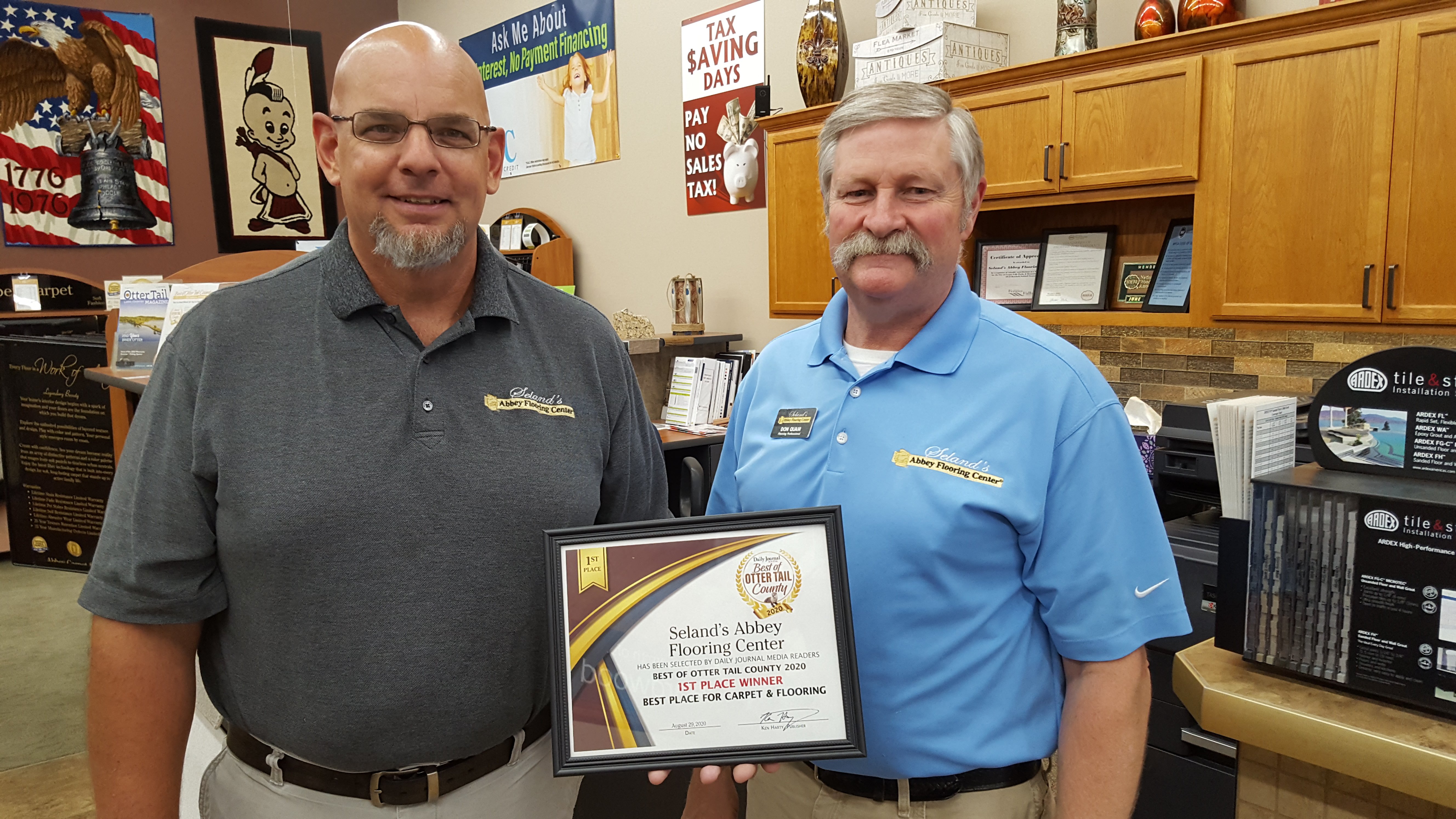 Rich and Don with first winner certificate for carpet floor and flooring for from Seland’s Abbey Flooring Center