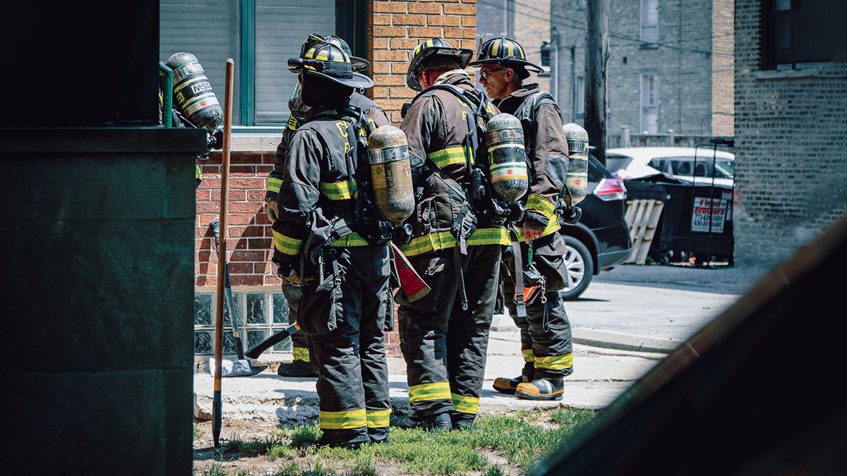 firefighters in action in a fire scene