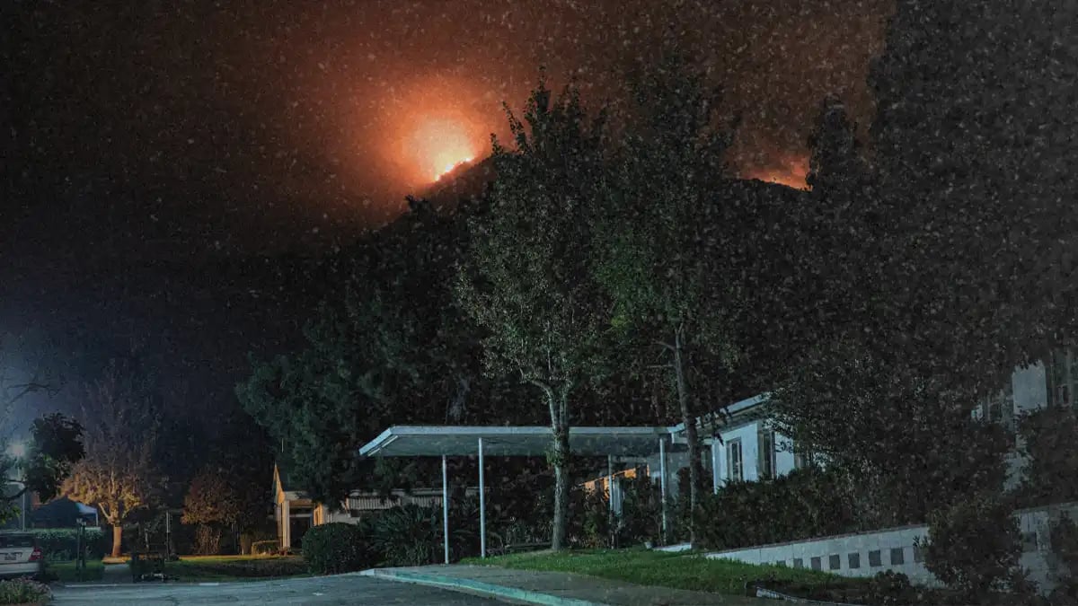 a dangerous wildfire threatening a residential area