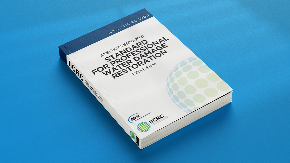 An ANSI/IICRC S500 standard book entitled Standard For Professional Water Damage Restoration with blue background