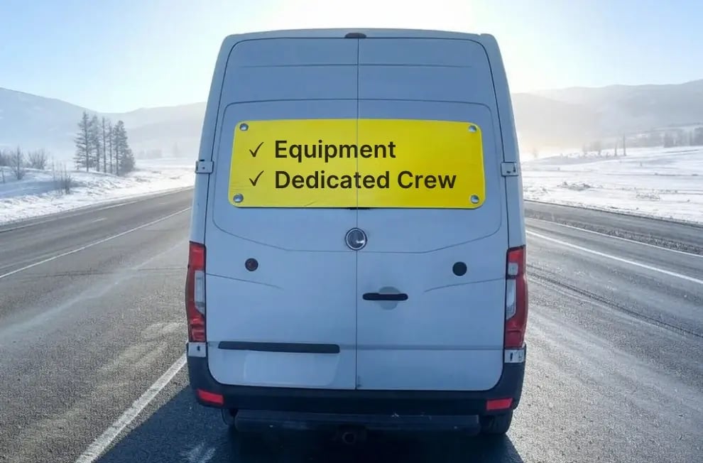 Water mitigation drying equipment cargo van truck for air mover, dehumidifiers in a winter storm area. with a yellow sign for dedicated crew.