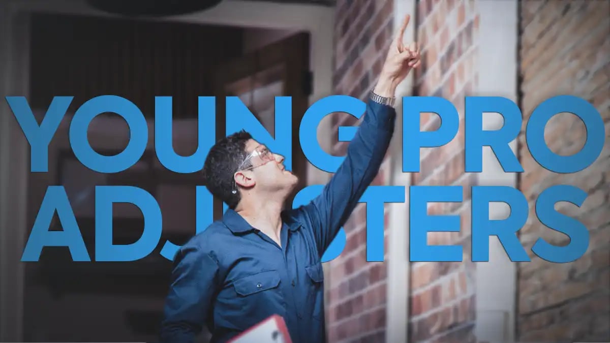 a man pointing on a brick wall against a text that writes, "Young Pro Adjusters"