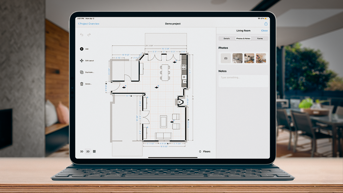 A magicplan floor plan shown on an ipad with a keyboard in an oper air area of a house