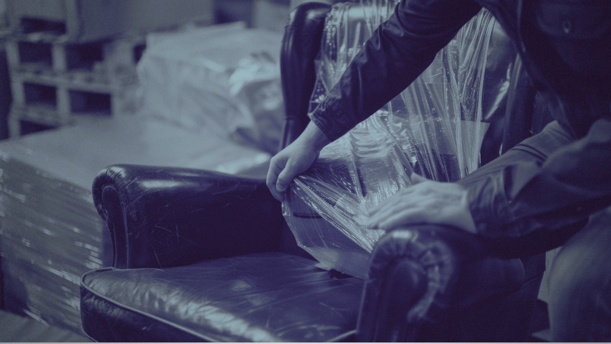 Restoration employees covering furniture or fixtures at a restoration job site