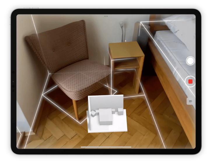 Scanning a room with an ipad using magicplan app lidar autoscan that detected a bed, a chair, the walls, a tables and much more.