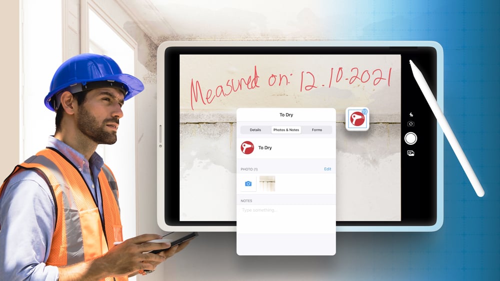 Restoration contractor assesing a water damage job with an ipad and adding a photo markup